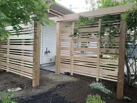 Van Ryder Project: horizontal cedar privacy screens beside the house