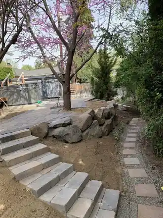 Van Ryder Project: stone steps under a blooming redbud tree